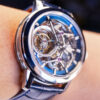 Side view of luxury blue skeleton tourbillon watch on wrist, ideal for high-end microbrand private label manufacturing by WatchesHome.